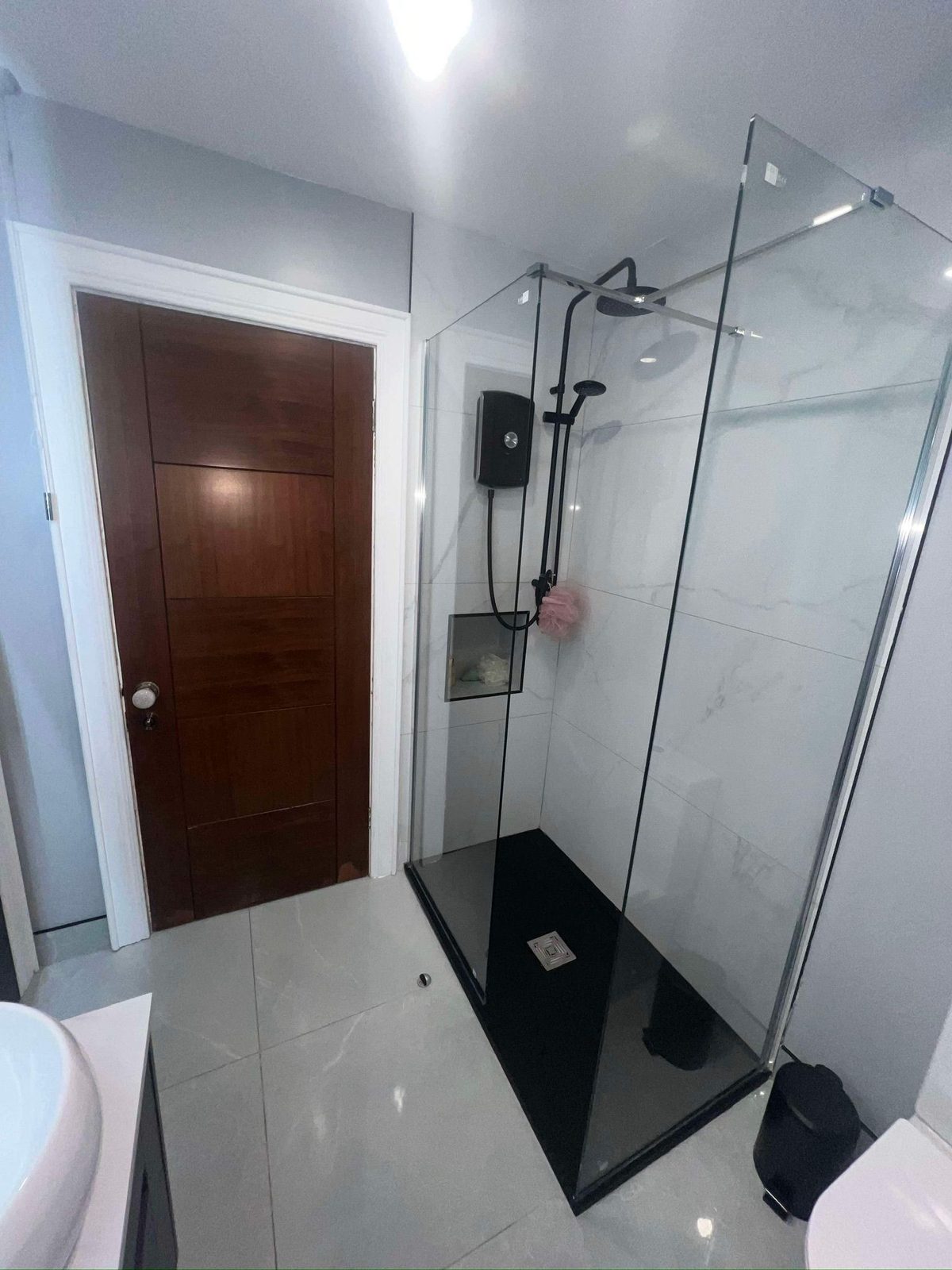 Marble-tiled walk-in shower