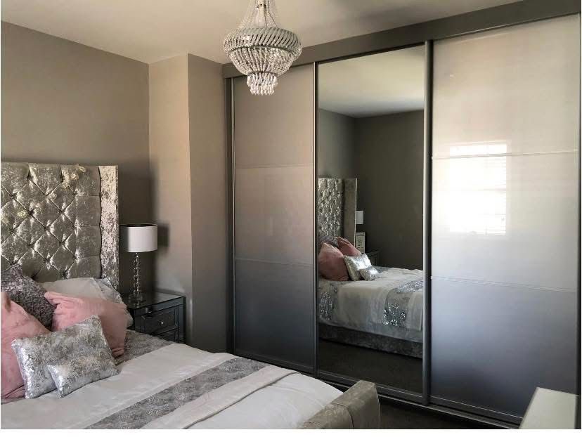 Gloss and mirrored sliding wardrobes